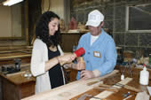 Craftsman allows visitor to chisel part of a frame